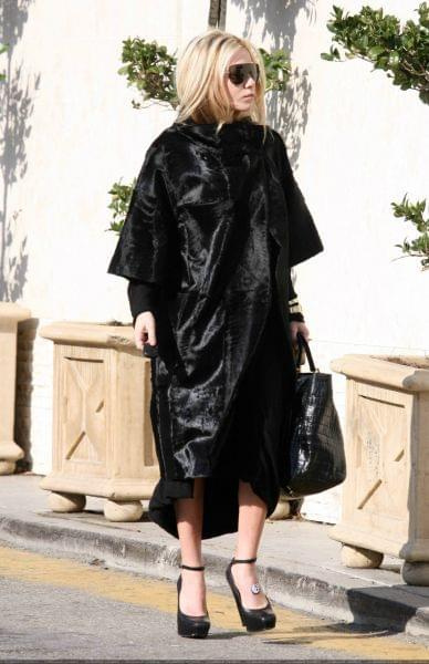 Ashley out and about in a black fur coat