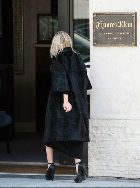 Ashley out and about in a black fur coat