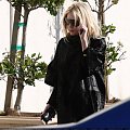 Ashley out and about in a black fur coat